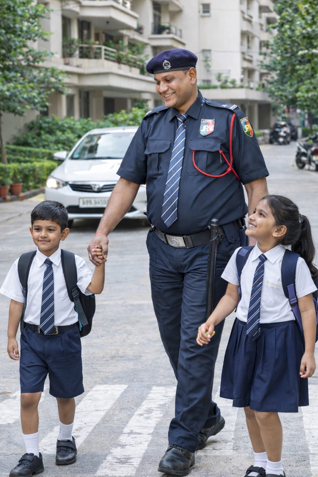 Security guard helping school children cross safely
